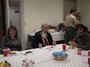 Michelle Lapalme, Orren Robbins and Alan Freitas eating pizza and cake